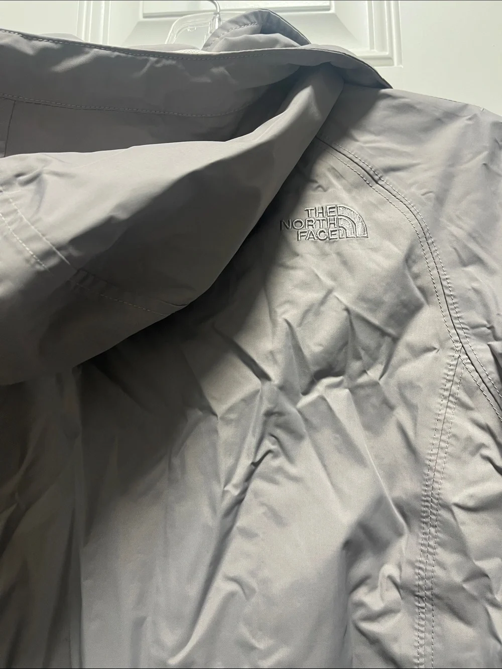 The North Face Light Gray women’s' Hooded Rain Jacket